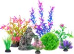 A colorful 8-piece set of Ameliade artificial aquarium plastic plants and a rock cave decoration for fish tanks.
