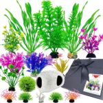 A 16-piece BOYIEENTER aquarium decoration set featuring colorful artificial plastic plants and a smooth fish cave rock.