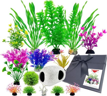 A 16-piece BOYIEENTER aquarium decoration set featuring colorful artificial plastic plants and a smooth fish cave rock.