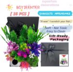 A 16-piece BOYIEENTER aquarium decoration set featuring colorful artificial plastic plants and a smooth fish cave rock.