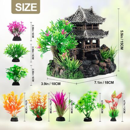 A gray resin castle aquarium decoration with arched entrances, surrounded by eight green and purple artificial aquarium plant