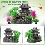 A gray resin castle aquarium decoration with arched entrances, surrounded by eight green and purple artificial aquarium plant