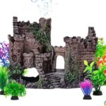 An ancient castle aquarium decoration set with a bubbler and seven artificial green plants in a fish tank.