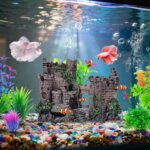 An ancient castle aquarium decoration set with a bubbler and seven artificial green plants in a fish tank.