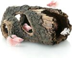 A brown, textured resin tree trunk aquarium decoration with multiple holes, providing a hiding spot for small fish.
