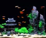 Multicolor resin castle aquarium decoration featuring an Eastern Tower design, providing shelter for fish.