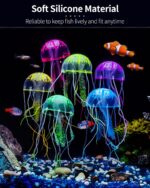 Six colorful silicone jellyfish ornaments in blue, purple, green, orange, pink, and yellow floating in a fish tank under blue