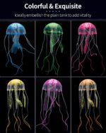 Six colorful silicone jellyfish ornaments in blue, purple, green, orange, pink, and yellow floating in a fish tank under blue