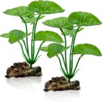 Two UreverFins artificial silk aquarium plants with driftwood bases, realistic green and brown colors, in a fish tank.