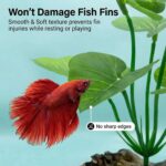Two UreverFins artificial silk aquarium plants with driftwood bases, realistic green and brown colors, in a fish tank.