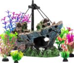 An 8-piece aquarium decoration set featuring a multicolored resin sunken ship and seven artificial green aquatic plants.