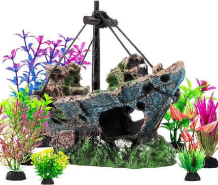 An 8-piece aquarium decoration set featuring a multicolored resin sunken ship and seven artificial green aquatic plants.