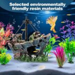 An 8-piece aquarium decoration set featuring a multicolored resin sunken ship and seven artificial green aquatic plants.