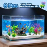 An 8-piece aquarium decoration set featuring a multicolored resin sunken ship and seven artificial green aquatic plants.
