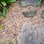 A clear bag filled with 5 pounds of multicolor, rounded 1/4-inch natural river rocks, suitable for aquariums and plants.